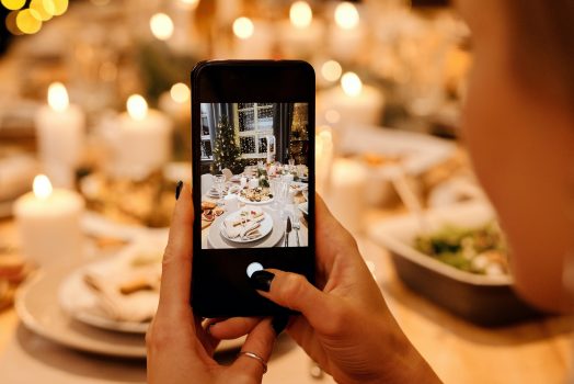 cellphone taking photo of holiday table