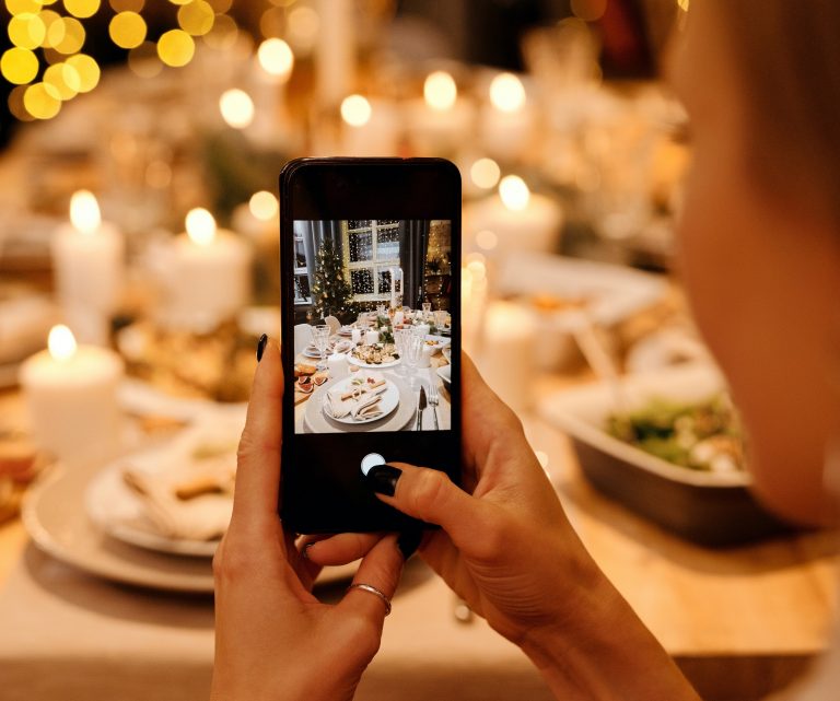 cellphone taking photo of holiday table