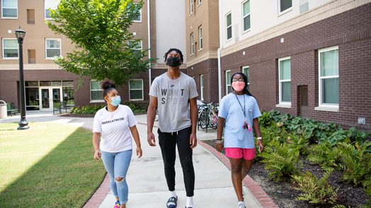 Three students walking