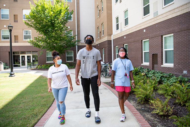 Three students walking