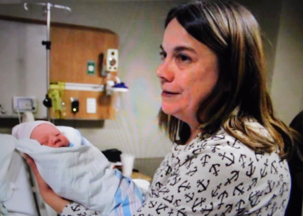 woman holding a baby