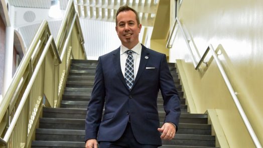 man walking downstairs