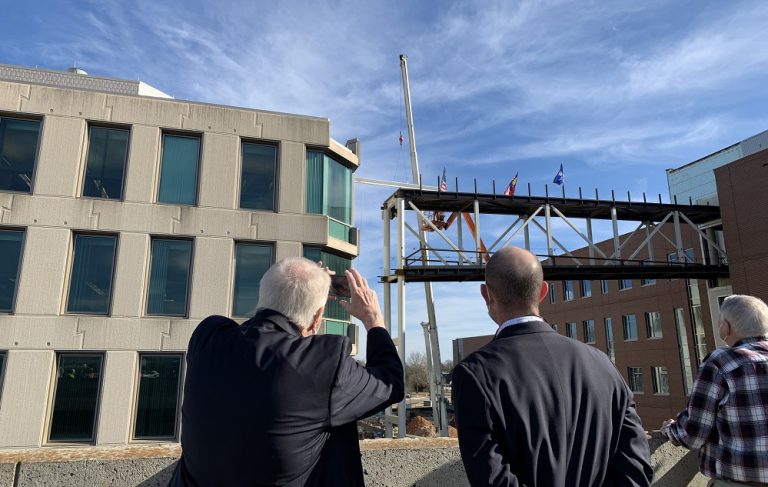 Man takes photo of construction site with phone
