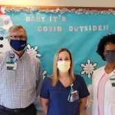 man and two women standing