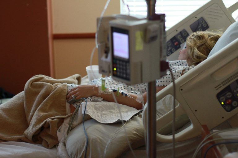 Person in a hospital bed.