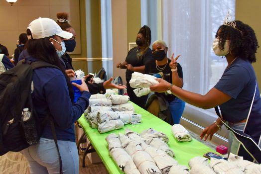 Students handing out t-shirts
