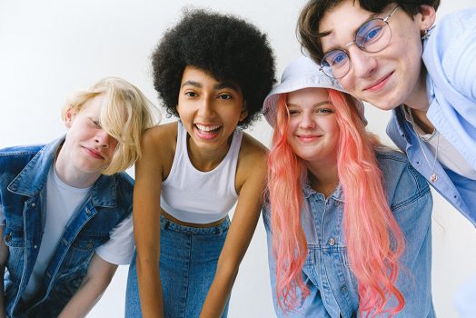 Four teens looking at camera