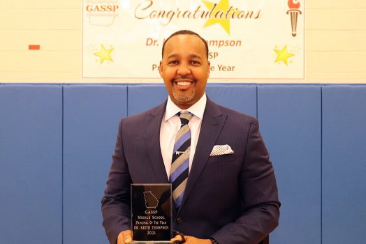 Man holding award