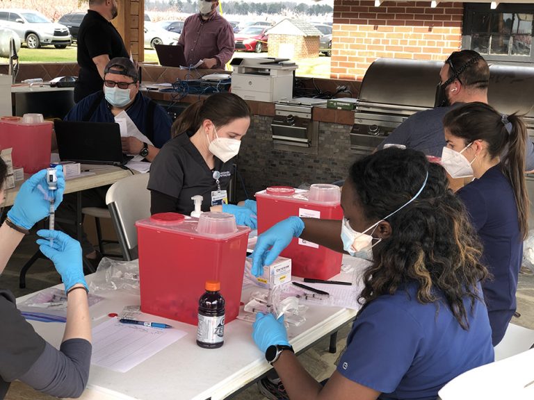 men and women at tables