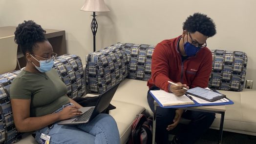 two adult students studying