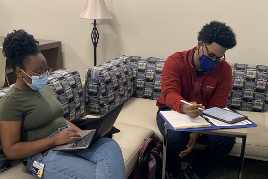 two adult students studying