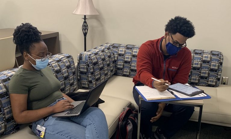 two adult students studying