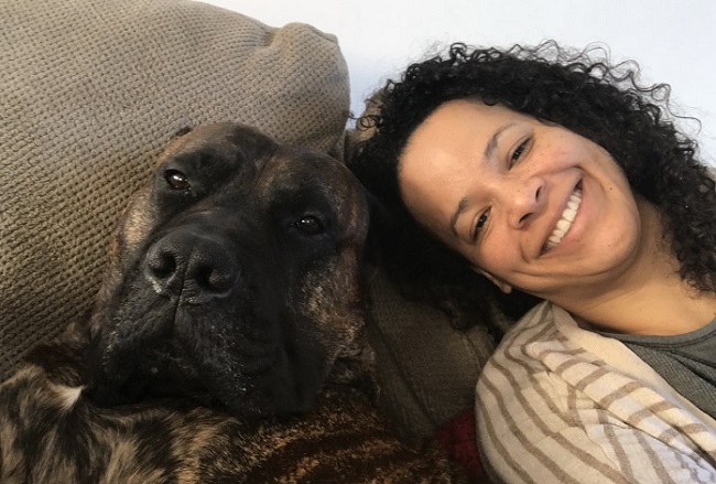 dog and woman on couch