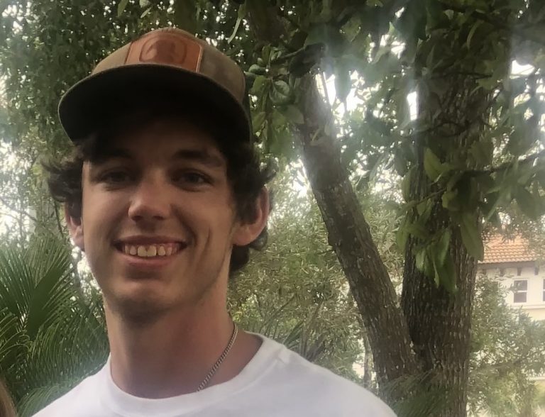 young man wearing cap
