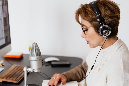 Woman speaking into a mic