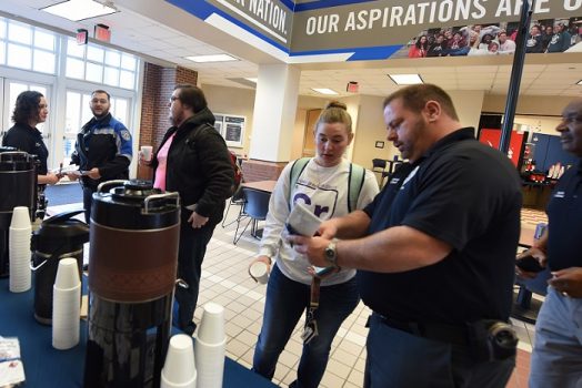 Officer with students
