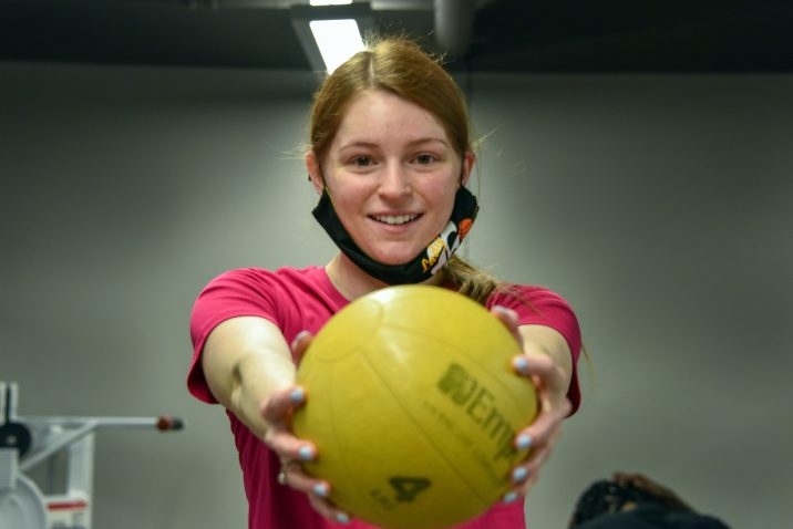girl holding ball