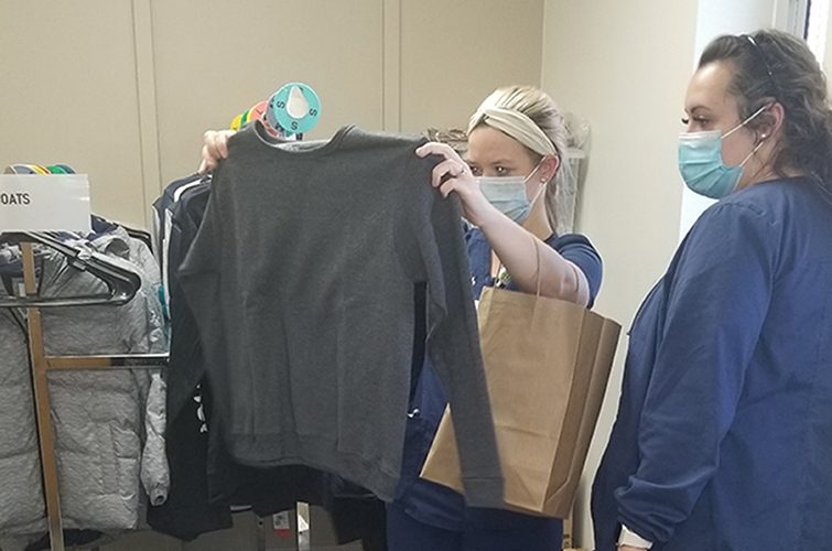 Two women looking at clothes