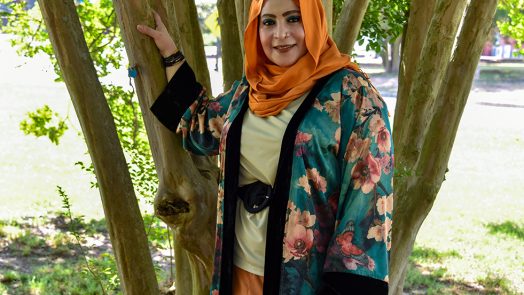 Woman in hijab under tree