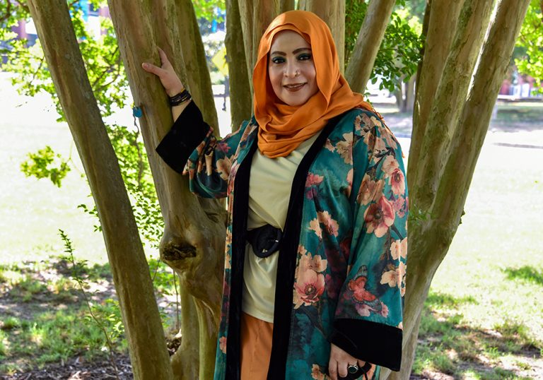 Woman in hijab under tree