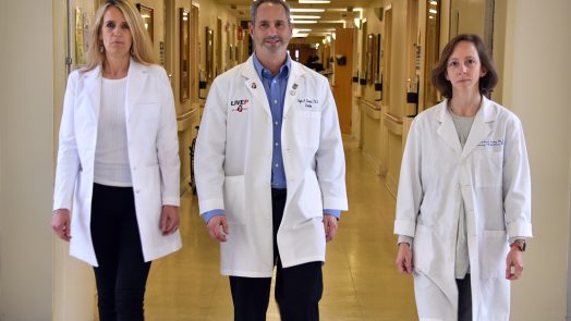 Three doctors walking