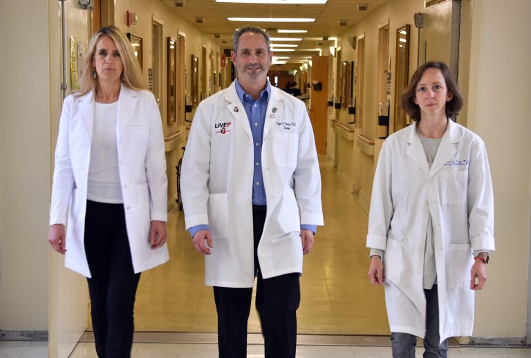 Three doctors walking