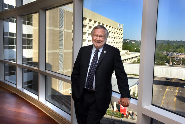 man in front of window