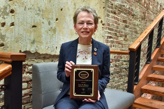 Woman holding a plaque