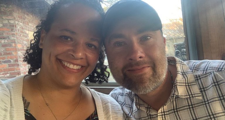 man and wife with heads together