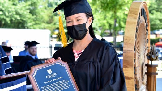 Graduate with award