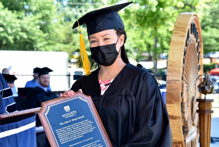 Graduate with award