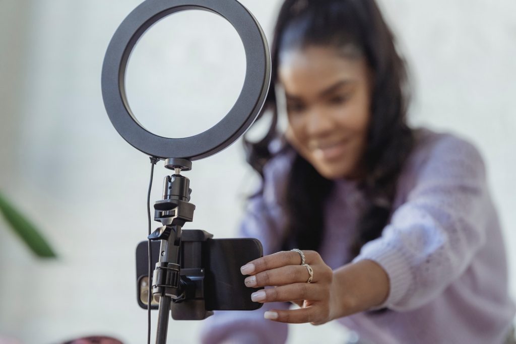 Woman filming with her phone