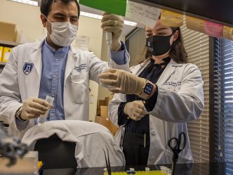 Two people working in lab