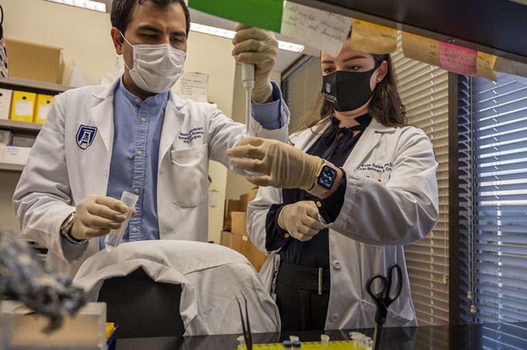Two people working in lab