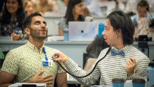 students use stethoscope on each other