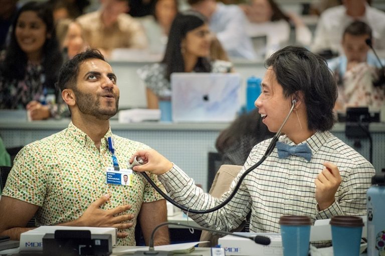 students use stethoscope on each other