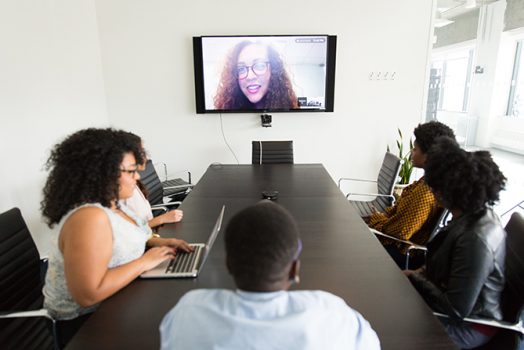 People meeting virtually and in person