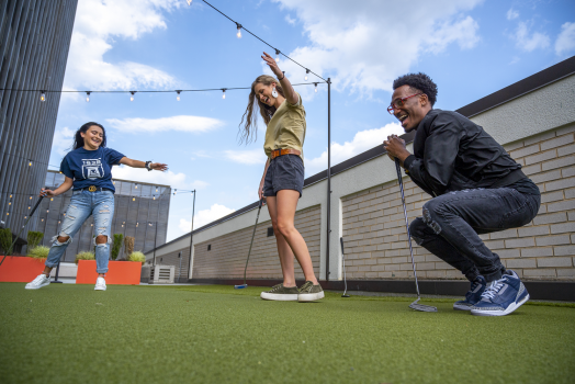 People playing mini golf
