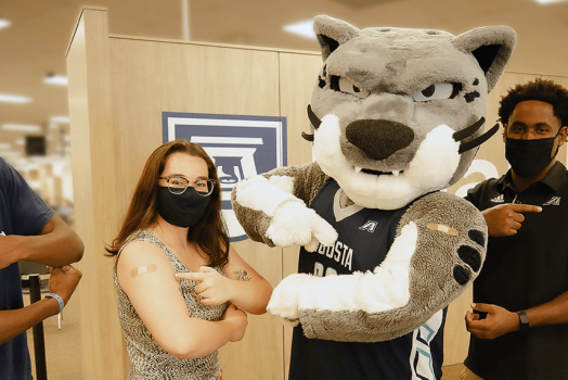 People with Jaguar mascot