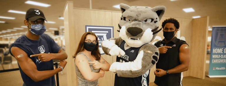 People with Jaguar mascot