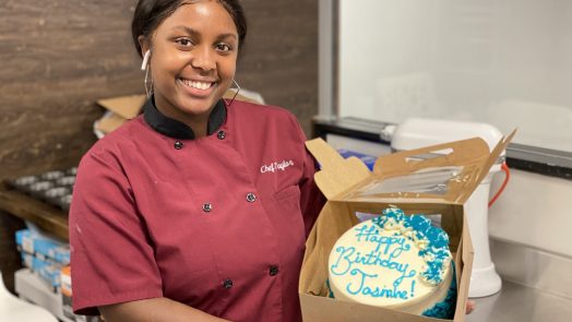 woman smiling with cake
