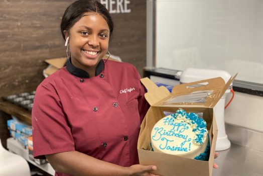 woman smiling with cake