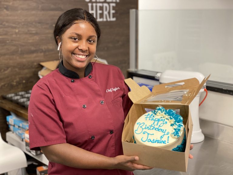 woman smiling with cake
