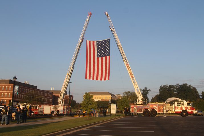 Firetrucks displaying American flag
