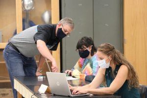 three people on the laptop