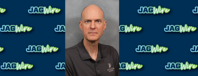 headshot of Dr. Morris over blue background