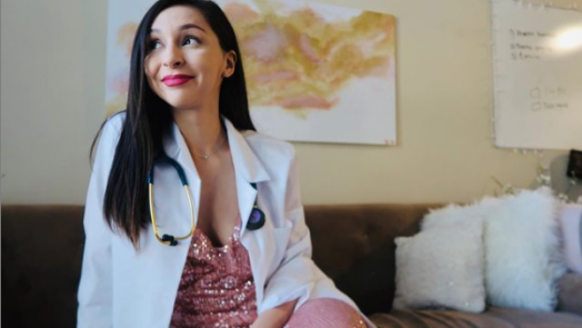 woman smiling in white coat