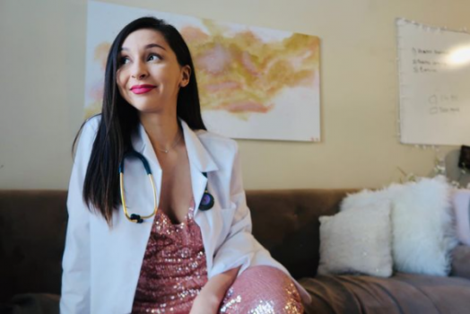 woman smiling in white coat