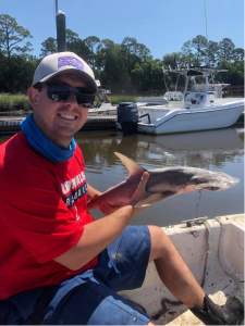 student holding fish