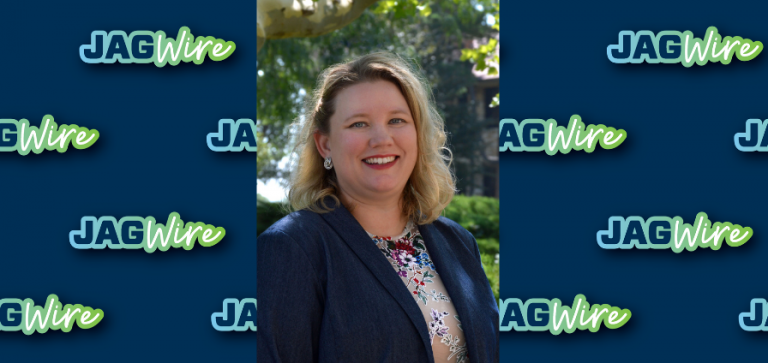 headshot of a woman over a blue background